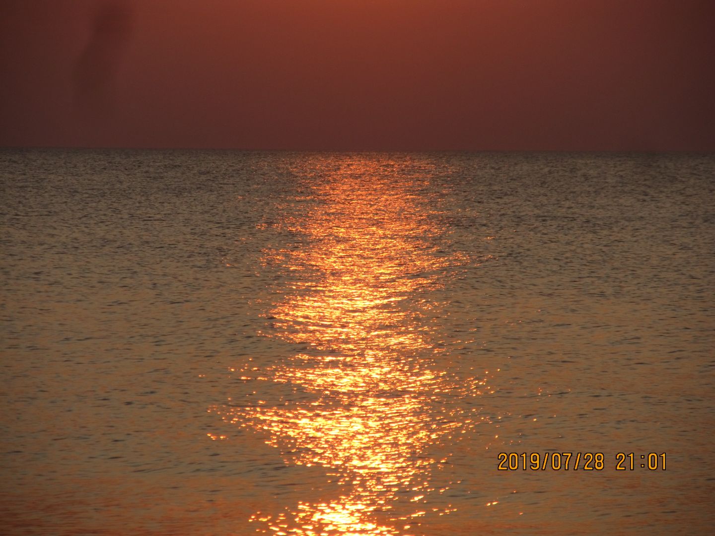 Sea colored red by evening sun